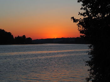 Scenic view of sea against orange sky