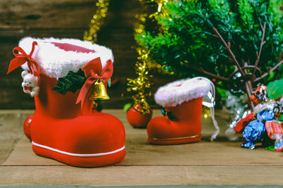 Close-up of red toy statue on table