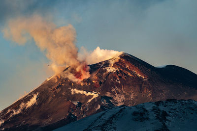 Smoke emitting from volcanic mountain