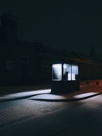 Booth in the dark covered in snow