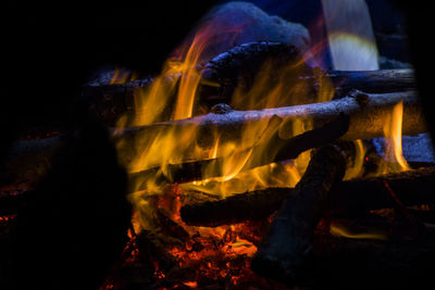 View of fire on log at night