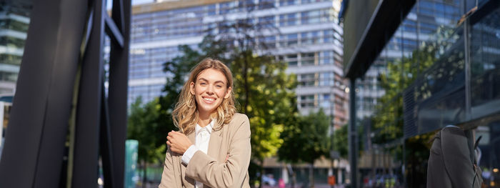 Young woman standing in city