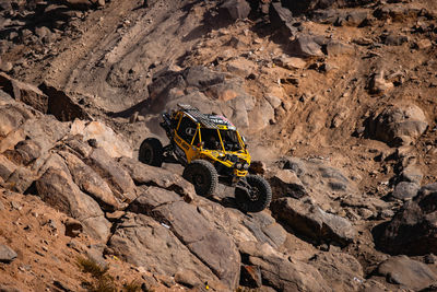 Off-road can am maverick racing through the desert during king of hammers event