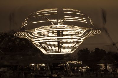 Low angle view of illuminated ferris wheel
