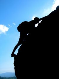 Silhouette of man against sky