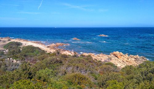 Scenic view of sea against blue sky