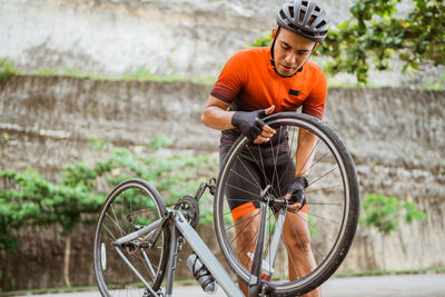 Side view of man riding bicycle