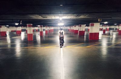 View of illuminated woman in subway