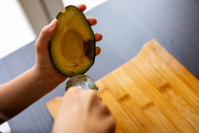 Cropped hand holding fruit