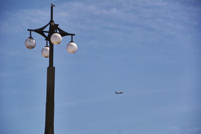 Low angle view of street light against sky