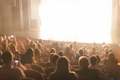 Audience at the theater watching a play