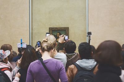 Young man holding camera