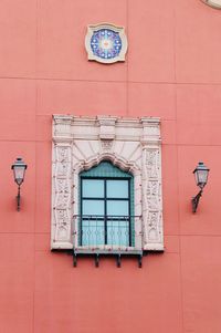 Low angle view of window on wall of building