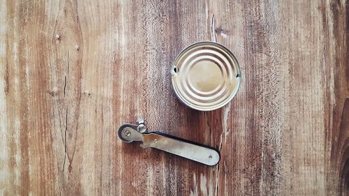 Directly above shot of can with opener on table