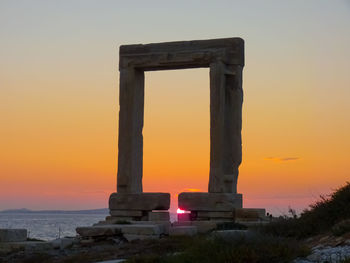 Built structure against sky during sunset