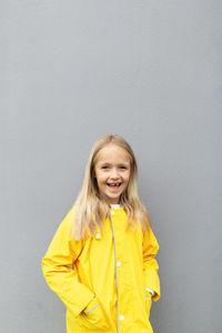 Kid in yellow raincoat  colors of the year 2021 ultimate gray and illuminating