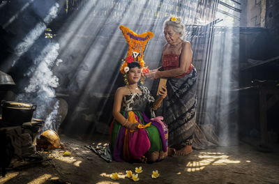 Balinese rejang dancer make up by her grandmother