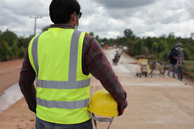 Rear view of man standing on street