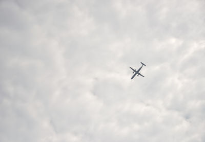 Low angle view of airplane flying in sky