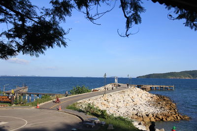 Road by sea against sky