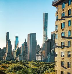 Panoramic view of modern buildings against clear sky