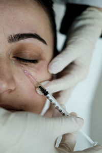 Close-up of doctor injecting syringe