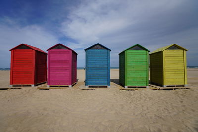 Beach huts against sky