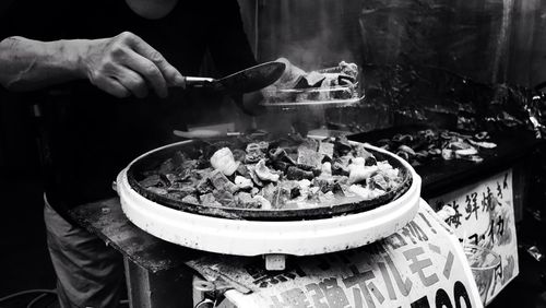 Midsection of man having street food