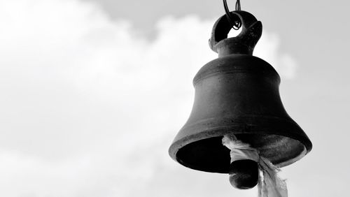 Close-up of bell against sky