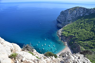 High angle view of rocks by sea