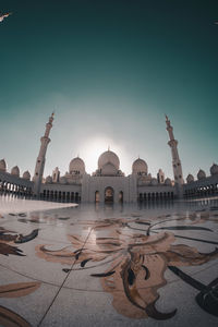 View of mosque against sky in city