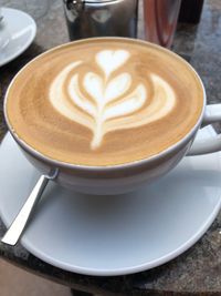 Close-up of cappuccino on table