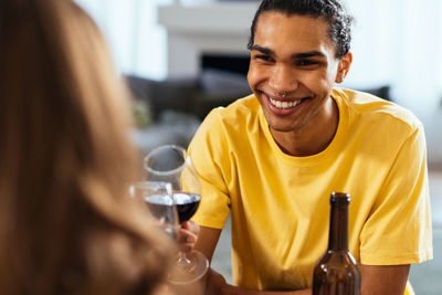 Portrait of young woman sitting at restaurant