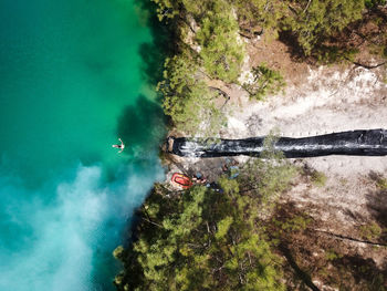 Aerial view of man swimming in lake