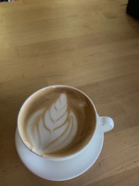 High angle view of cappuccino on table