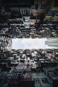 Low angle view of buildings in city against sky