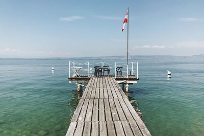 Pier over sea against sky