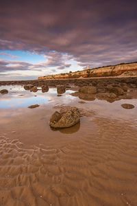 Scenic view of beach against sky