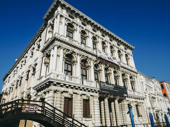 Low angle view of historical building against blue sky