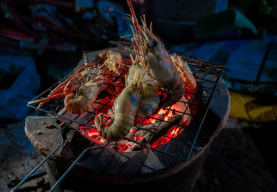 High angle view of shrimps on barbecue grill