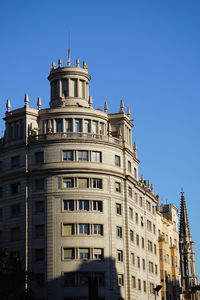 Low angle view of building against blue sky