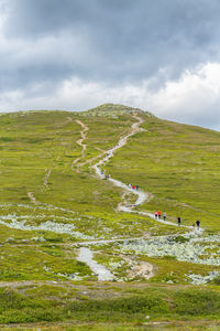 People heading to a mountain peak