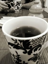 Coffee cup with coffee cup on table