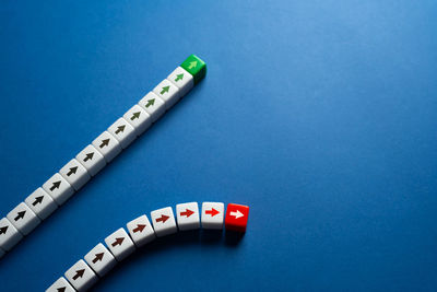 High angle view of tape measure on blue background