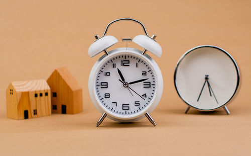 Close-up of clock on table