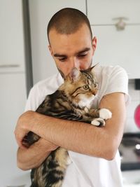 Portrait of a man with cat