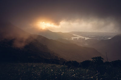 Scenic view of mountains against sky during sunset