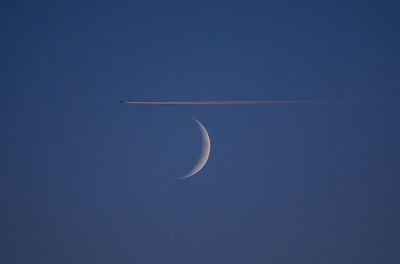 Low angle view of vapor trails in sky