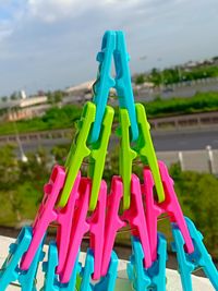 Close-up of multi colored clothespins on clothesline