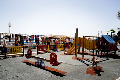 Playground against clear sky